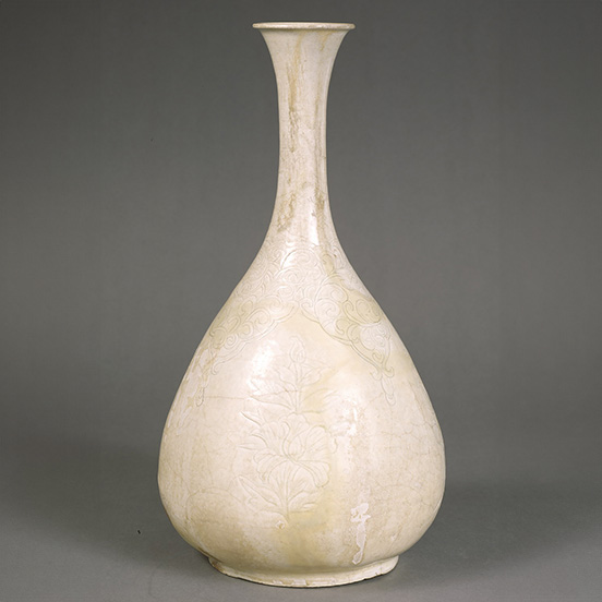 White Porcelain Vase with Carved Lotus and Peony Designs
