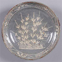 Dish with Bushclover. Nezumi Shino ware; glazed stoneware. Kyoto National Museum.